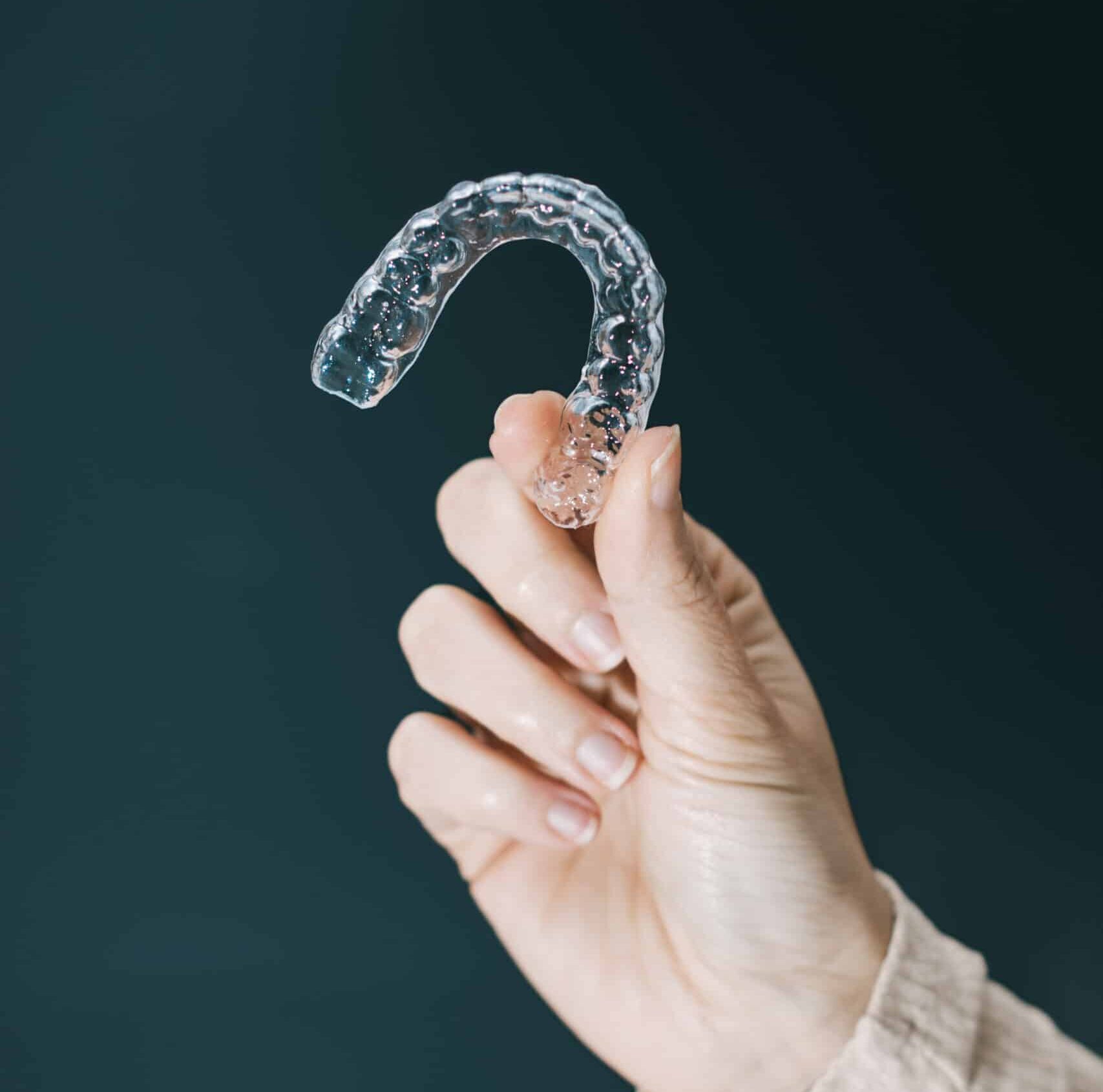 Straighten your teeth without the hassle of traditional braces through our Invisalign services.