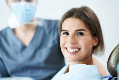 Male dentist and woman in dental clinic